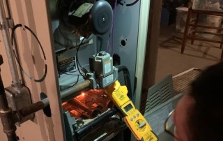 Furnace tune-up process with a technician in Milwaukee
