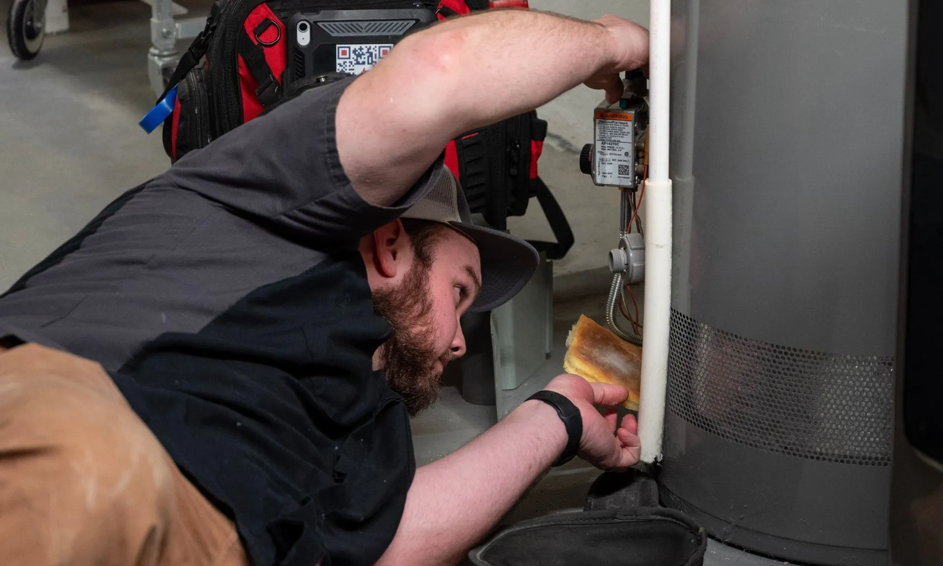 Licensed plumber replacing a water heater
